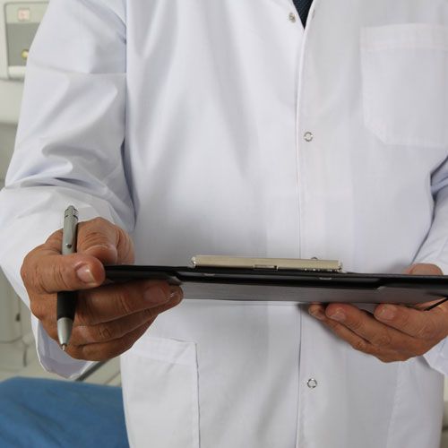 image of doctor taking notes on iPad